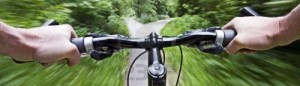 cropped-4922932-mountain-biking-down-hill-descending-fast-close-up.jpg